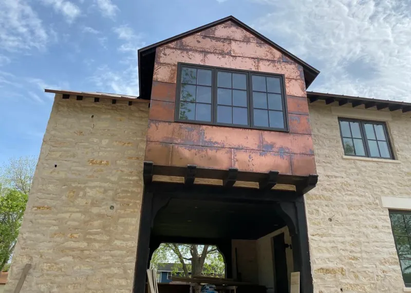 Copper metal panel facade on a stone building for Skylight Installation in Palmetto Bay